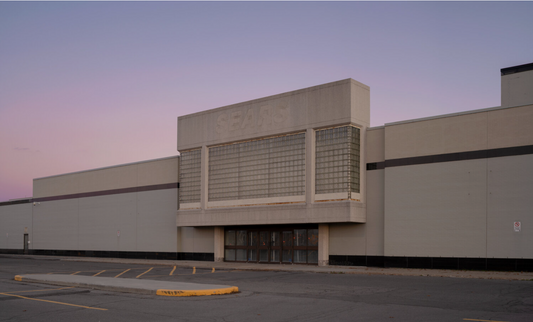An abandoned building with faded signage.