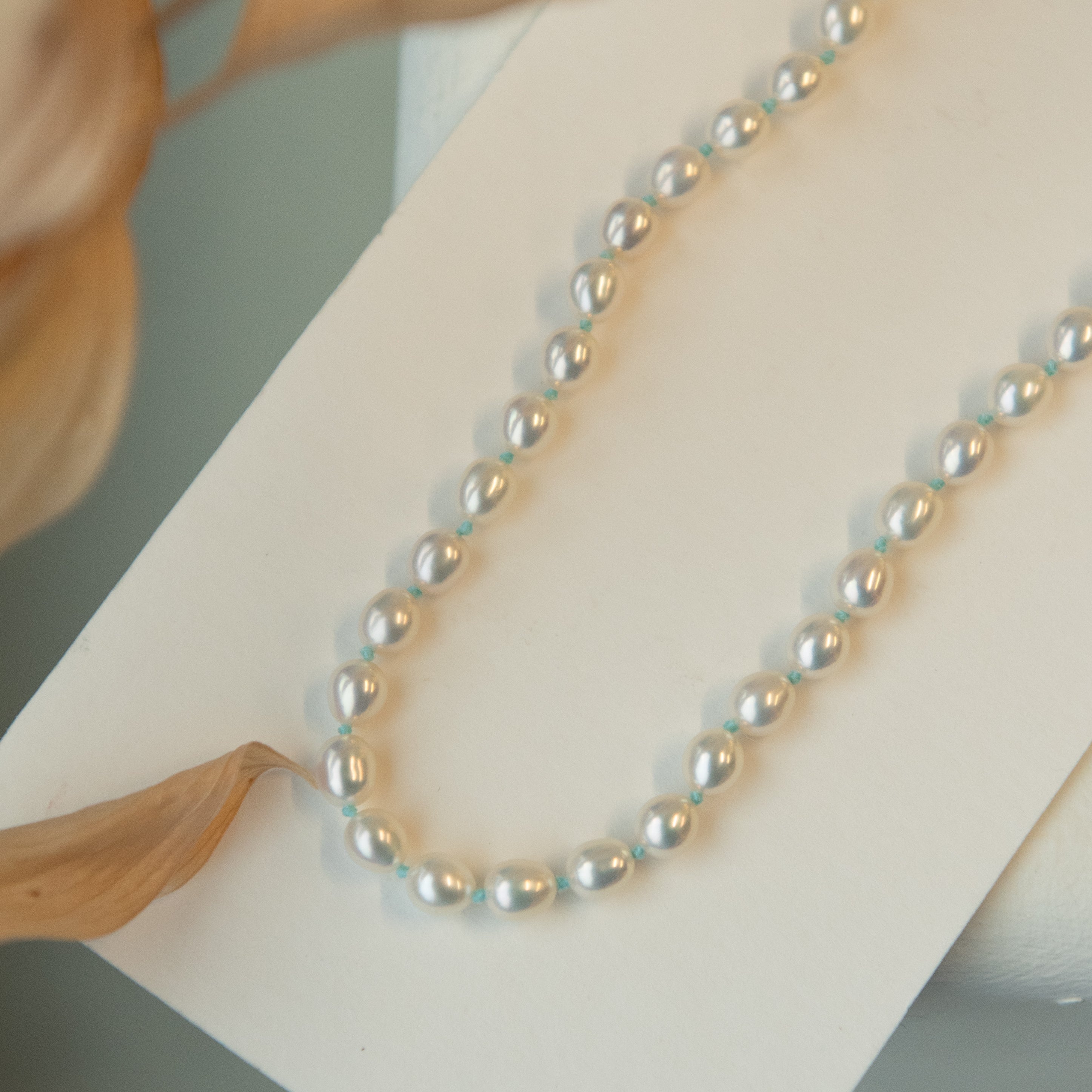 Pearl Necklace On A Green Background With Copy Space. 3d Rendering Stock  Photo, Picture and Royalty Free Image. Image 204632206.