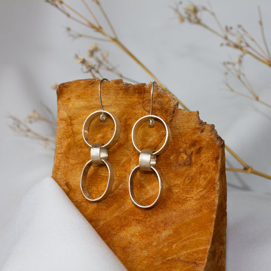 Galili Ellis, Linked Silver Closed Shape Dangle Earrings