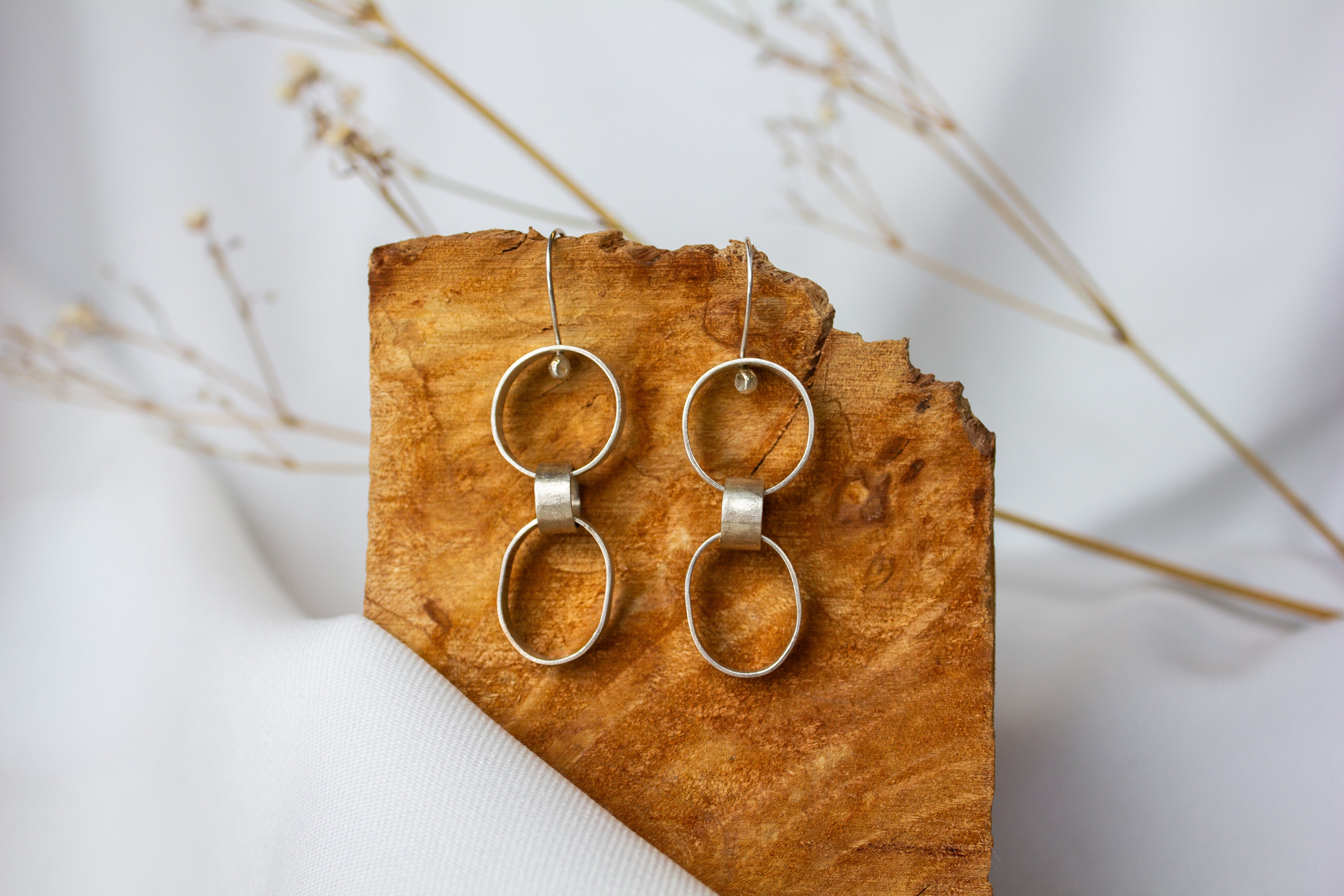 Galili Ellis, Linked Silver Closed Shape Dangle Earrings