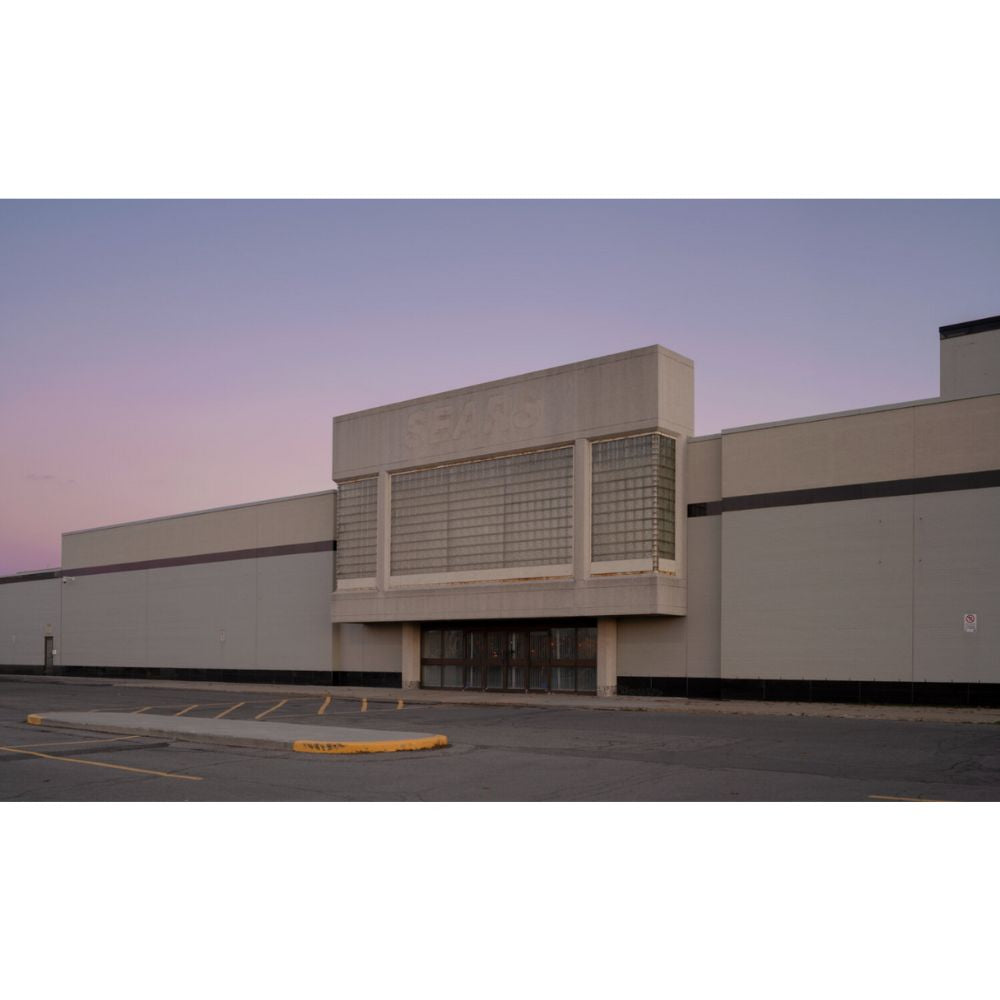 An abandoned building with faded signage.
