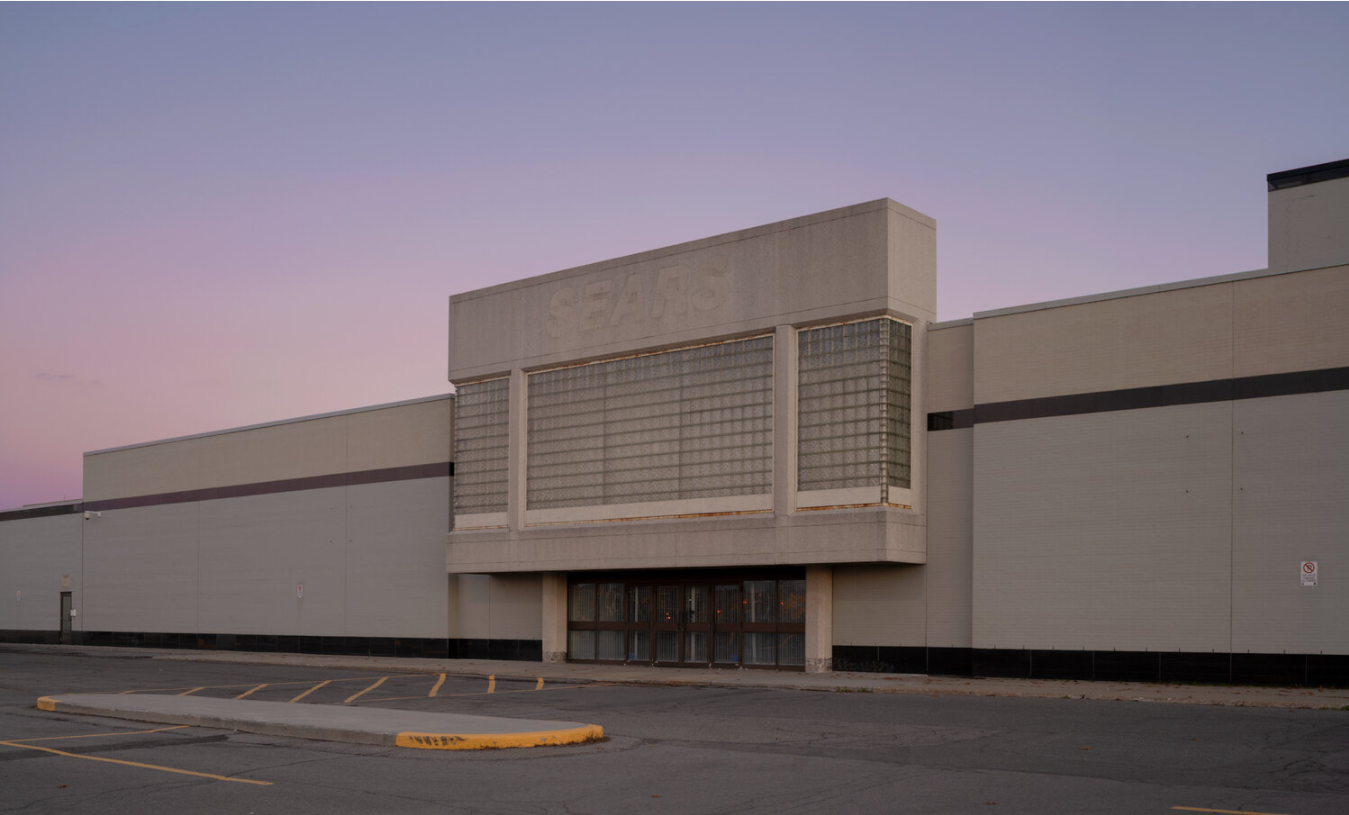 An abandoned building with faded signage.